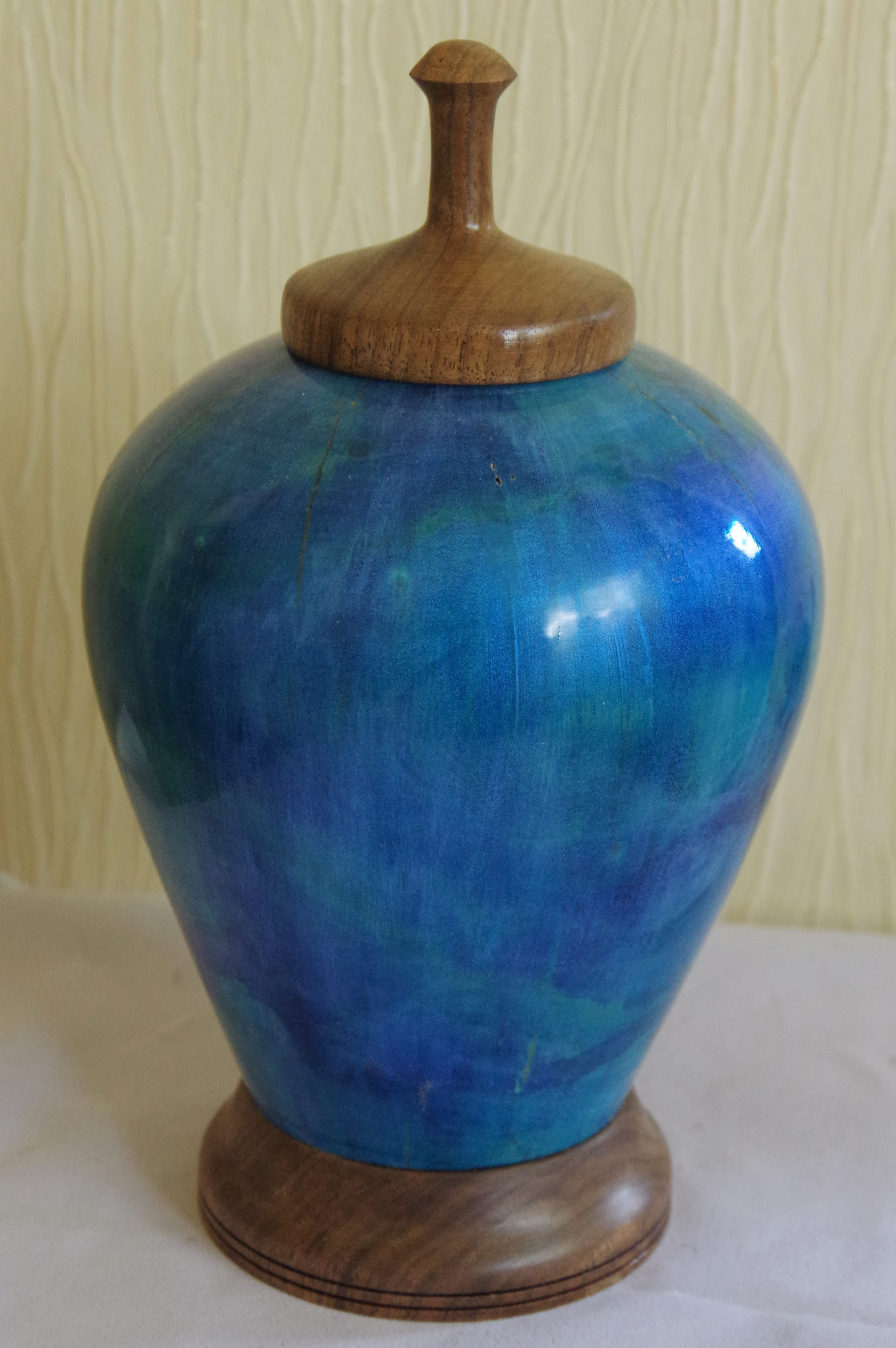 Blue painted ornament with walnut top and base